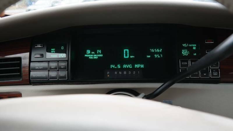 green cadillac deville with 76562 miles available now!