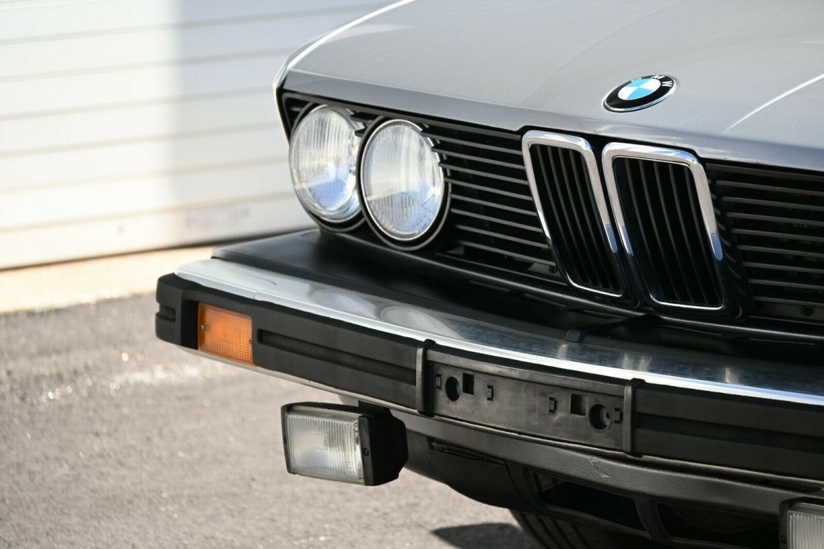 manual 5-speed, desirable and rare salmon silver over red leather, serviced