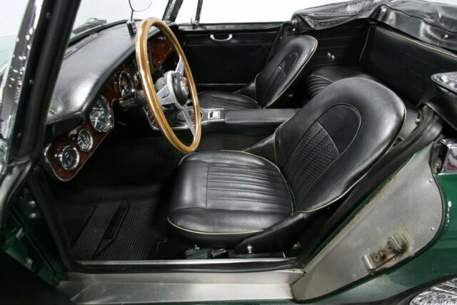 classic vintage chrome british english green black wire wheels restored roadster