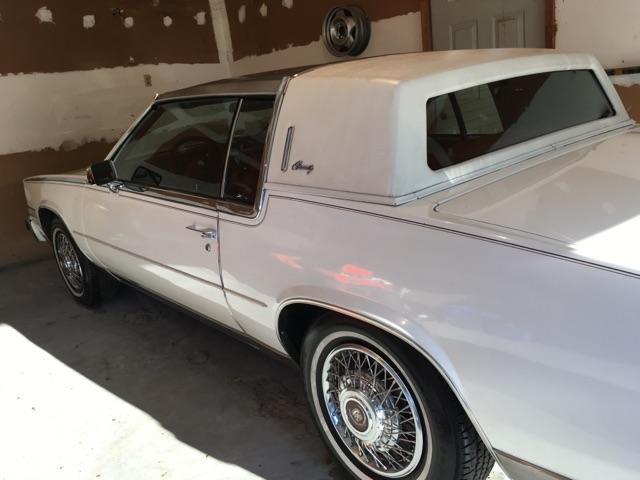 1984 white cadillac eldorado barritz with red interior and low mileage must sell