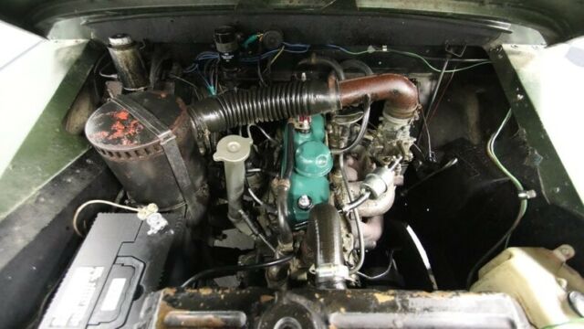 classic vintage chrome land rover inline 4 4-speed manual army green
