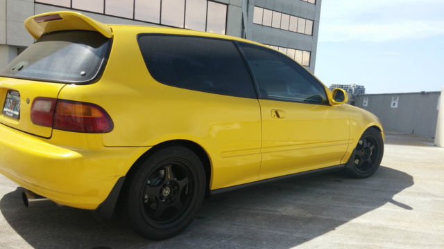 yellow hatchback with jdm b18c integra type r motor