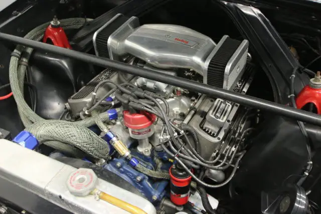 gorgeous raven black, strong 289 v8, edelbrock upgrades, cragars, slick look!