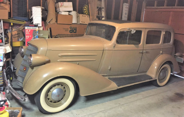 oldsmobile 1934 model l34, 8 cyclinder, 4 door sedan - plus some spare parts