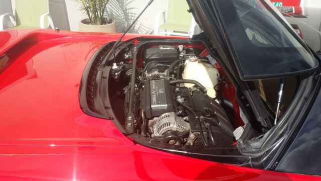 beautiful red with tan interior 5 speed 2 owner car
