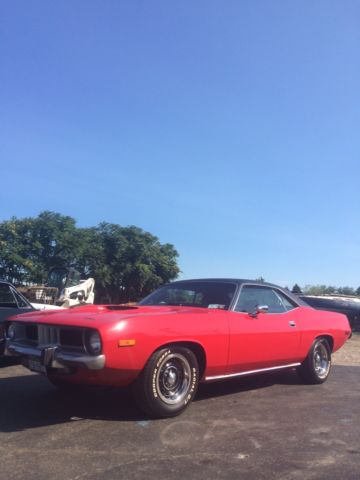 red 74' cuda with 4 speed trans and 340 engine