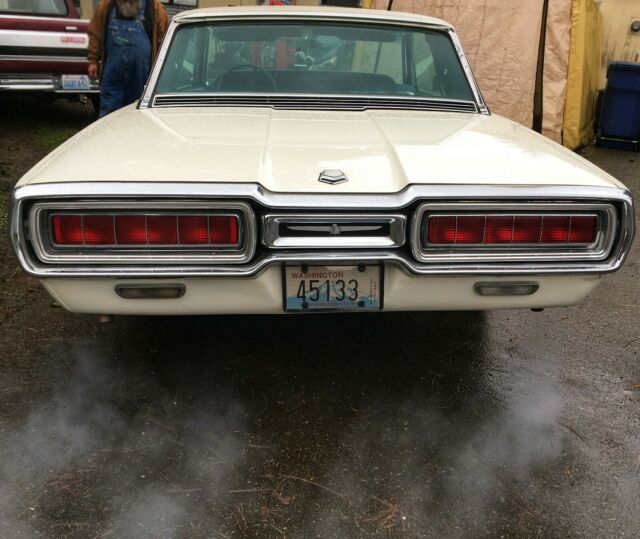 1965 white ford thunderbird with vibrant blue/turquoise interior exquisite