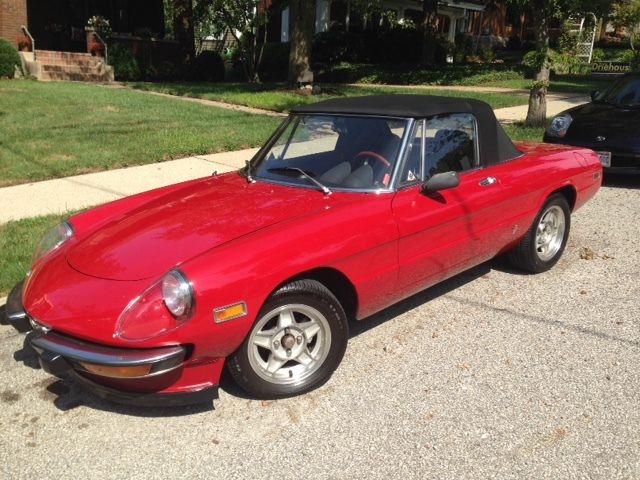 alfa romeo spyder with 65,095 miles. red with black covertable top and interior
