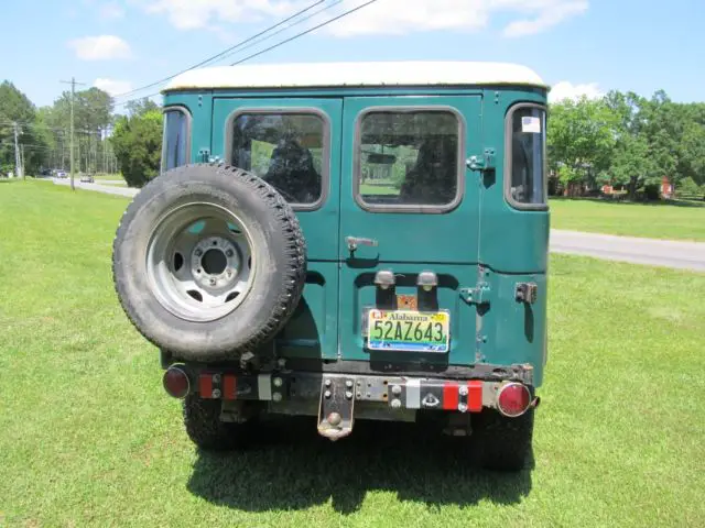 vintage 1970 toyota land cruiser f j 40 with lots of extras on it