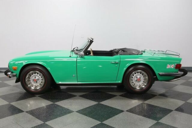 vintage classic chrome british compact sports car java green black wood grain