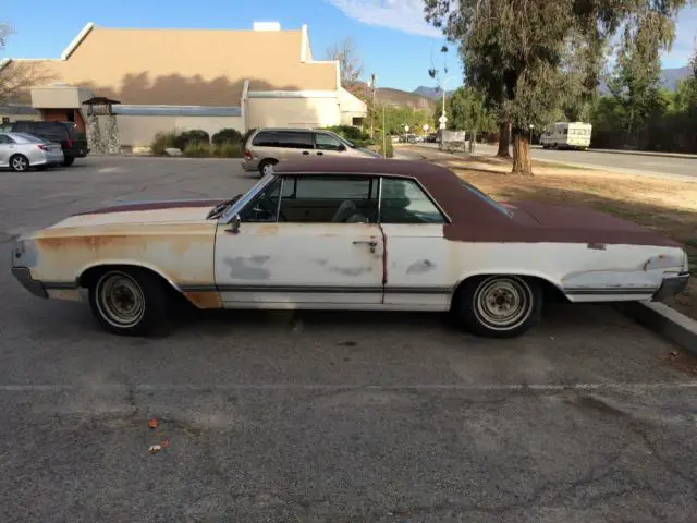 1965 olds cutlass,protect-o-plate, all original and complete, runs/drives well