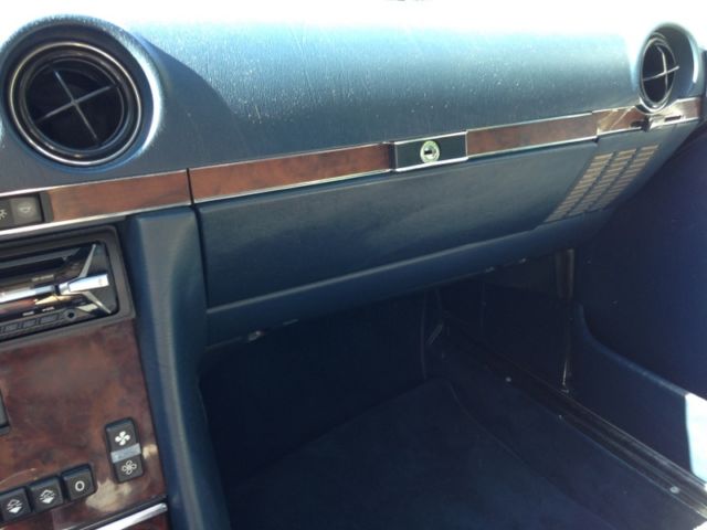 glacier white roadster w/hard top/blue rag top/blue interior. great condition!