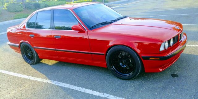 1991 e34 bmw m5 brillantrot exterior, black leather interior