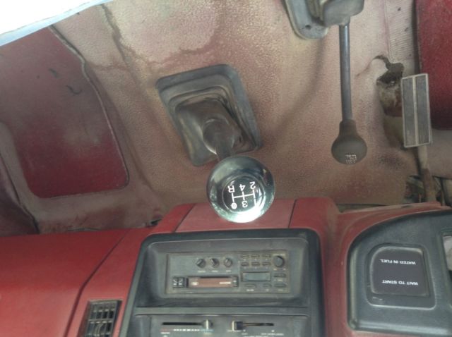 1988 red ford f 350 custom-4 wd-8 cyl-5 speed ,7.3 diesel flatbed, great puller