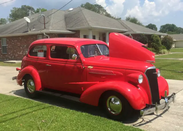 chev. 1937 2-door sedan , street cruiser ,red,tan interior,cold air,ps,pb