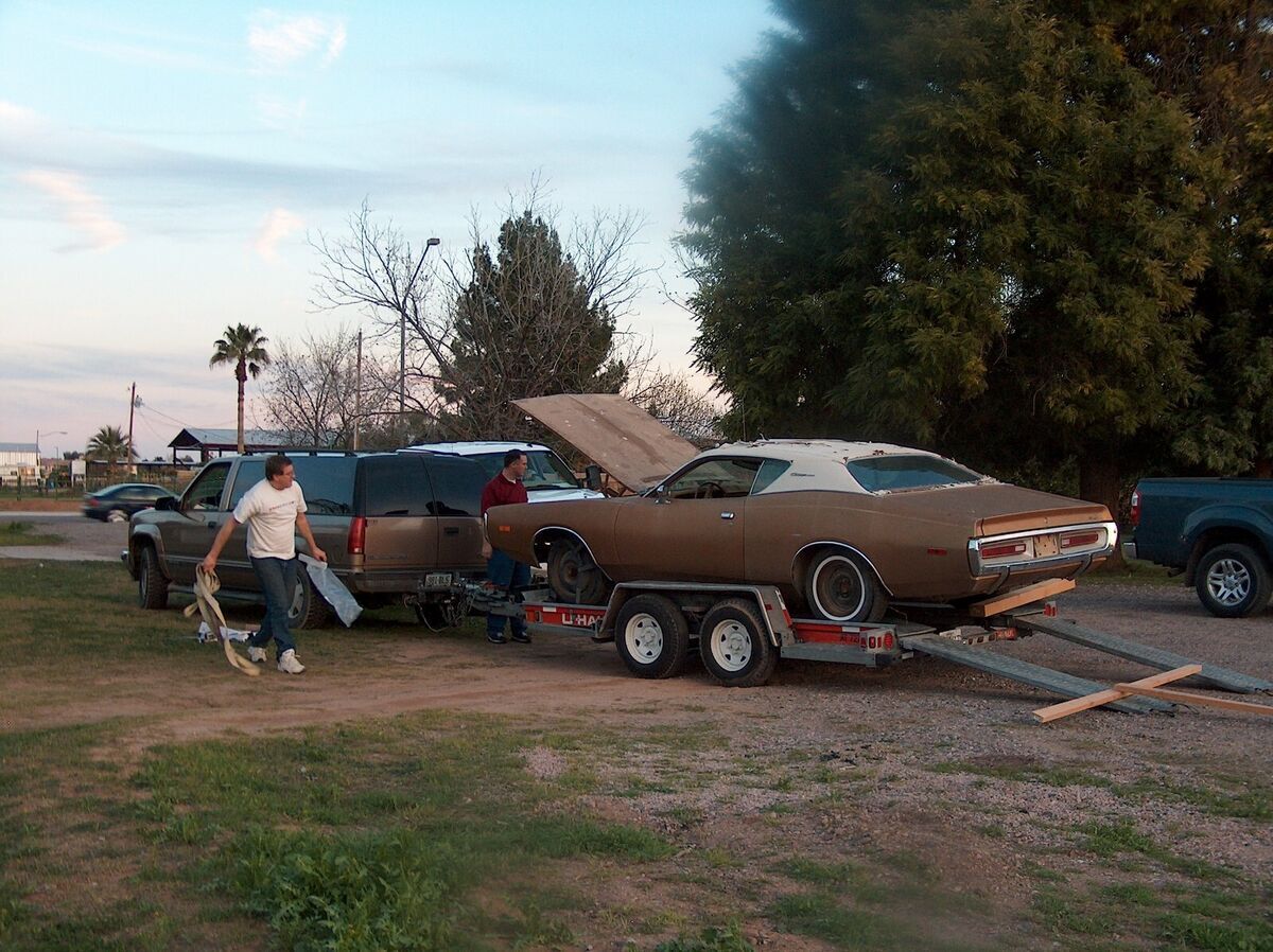 1972 charger with purple paint job and black vinyl top is restored from frame up
