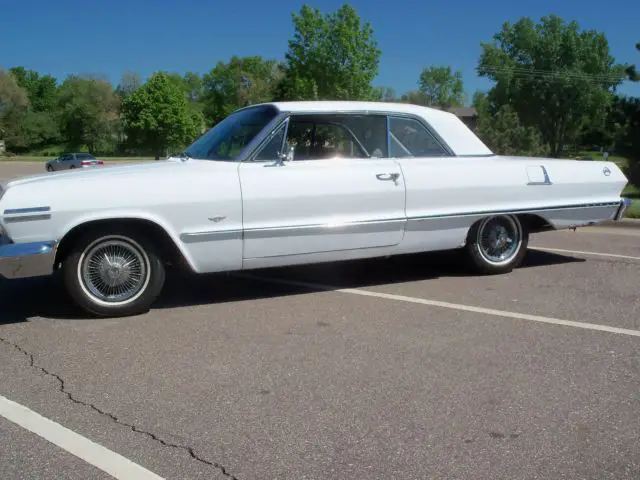 1963 chevrolet impala white/blue interior, factory air cond
