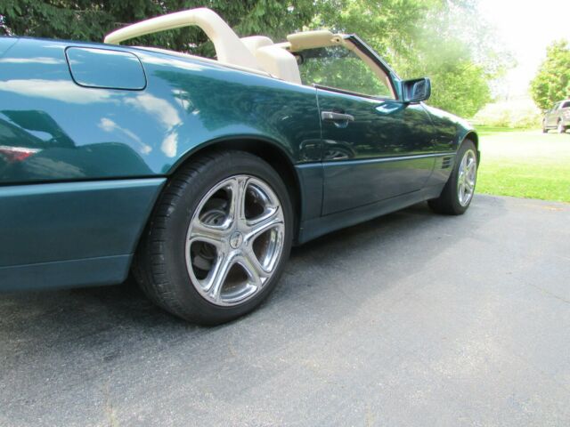 sharp looking benz sl500..metallic green,chrome wheels.new top, bmw porsche audi