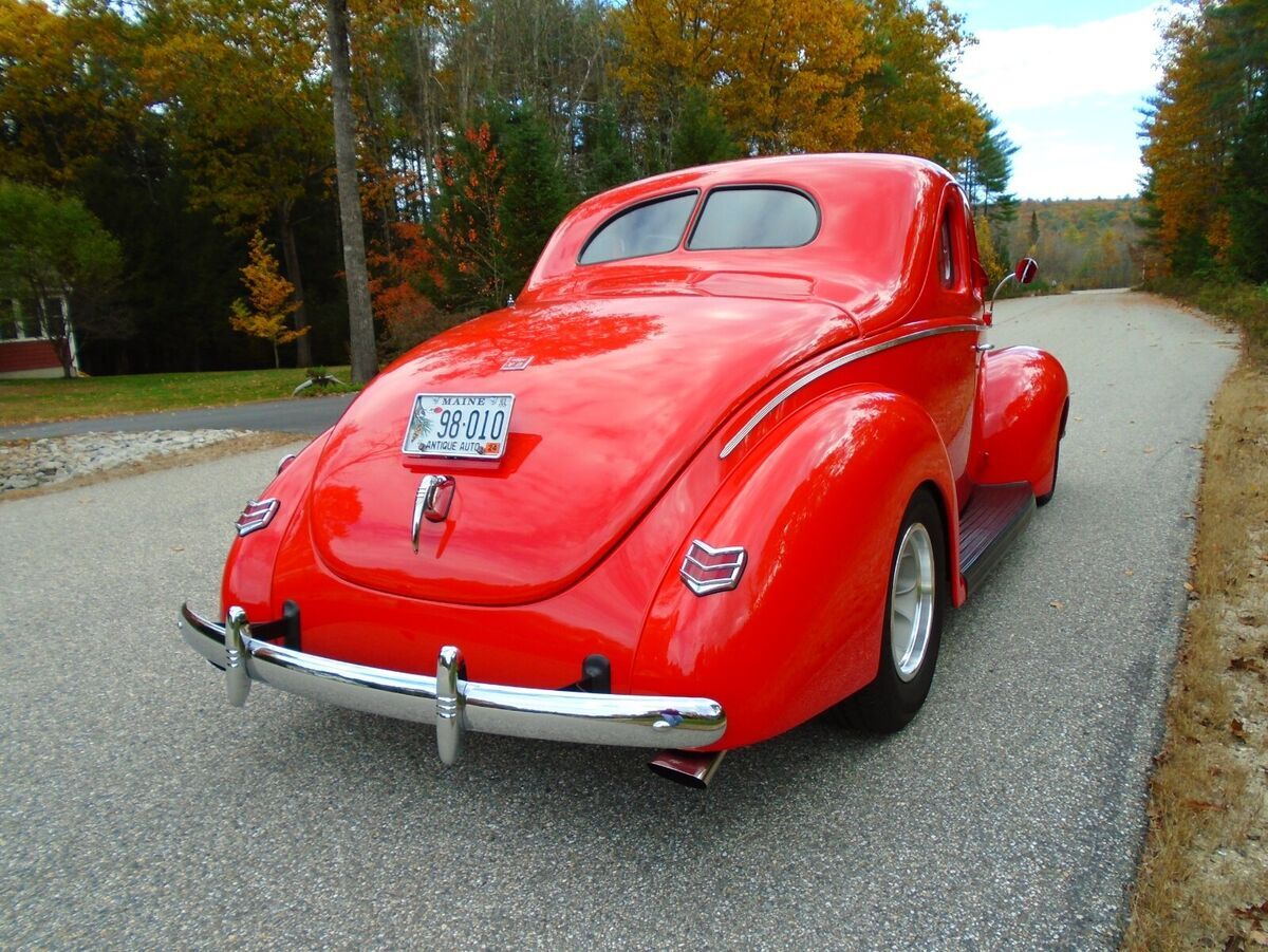 beautiful all steel 1940 ford deluxe coupe street rod. the beautiful bright red