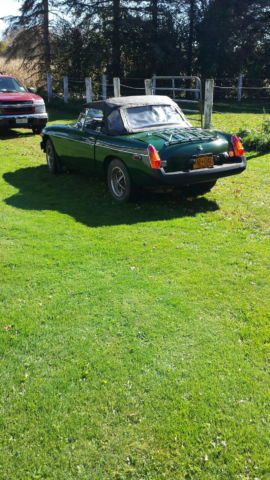 green convertible with black top