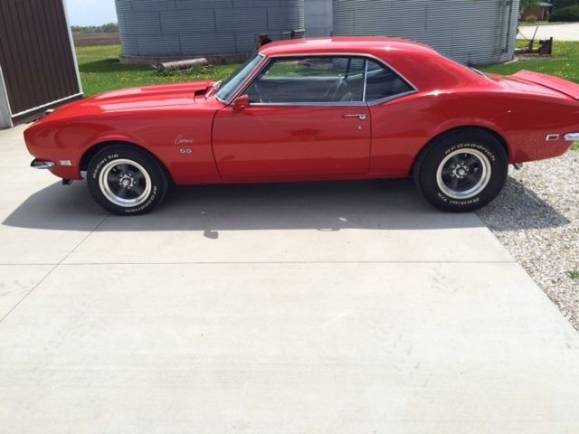 1968 with metallic red paint job with a lot of new parts