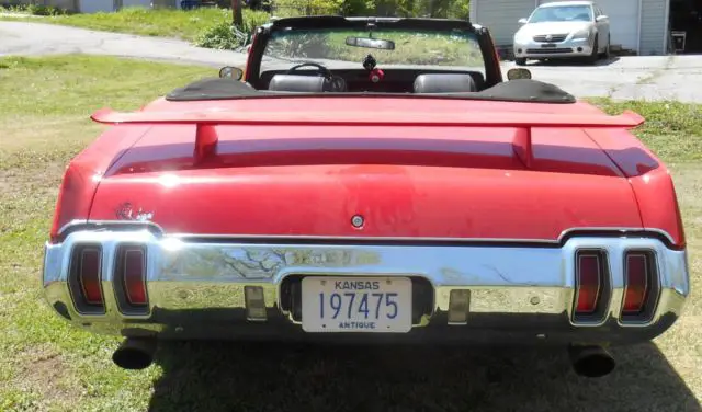 red 1970 cutlass convertible with a 1972 frontend (frontend damage)