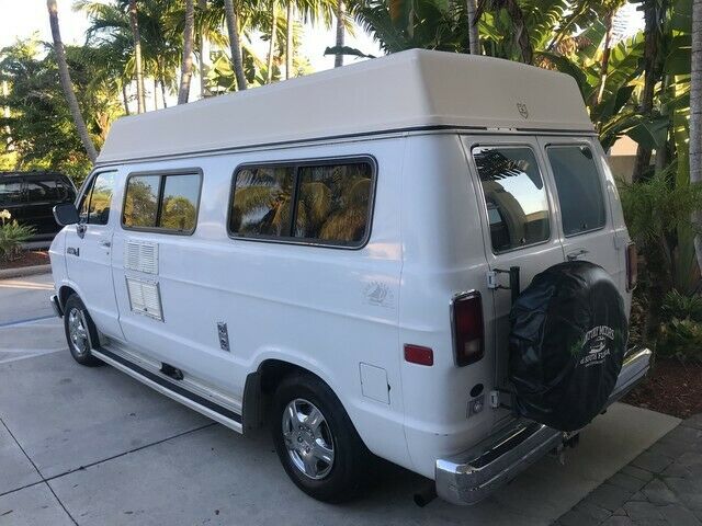 camper van stove sink fridge table bed microwave overhead storage