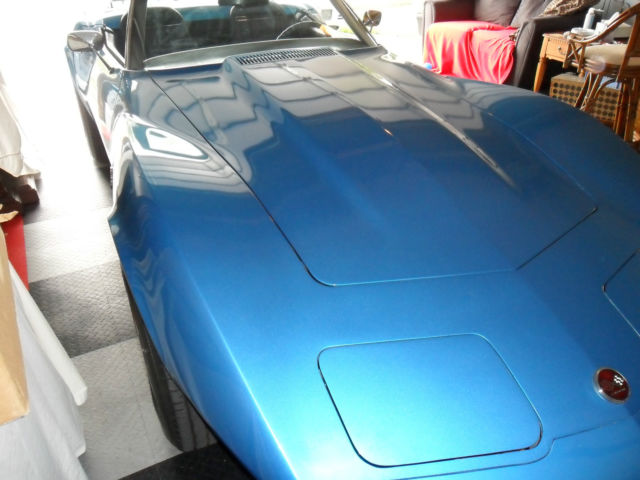 blue corvette convertible, automatic with blue interior and white top