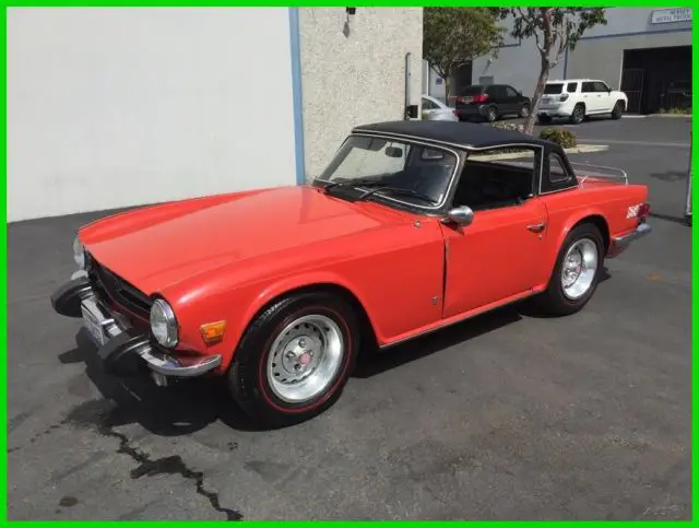 1975 triumph tr-6 convertible. red exterior / black trim. 4-speed. running