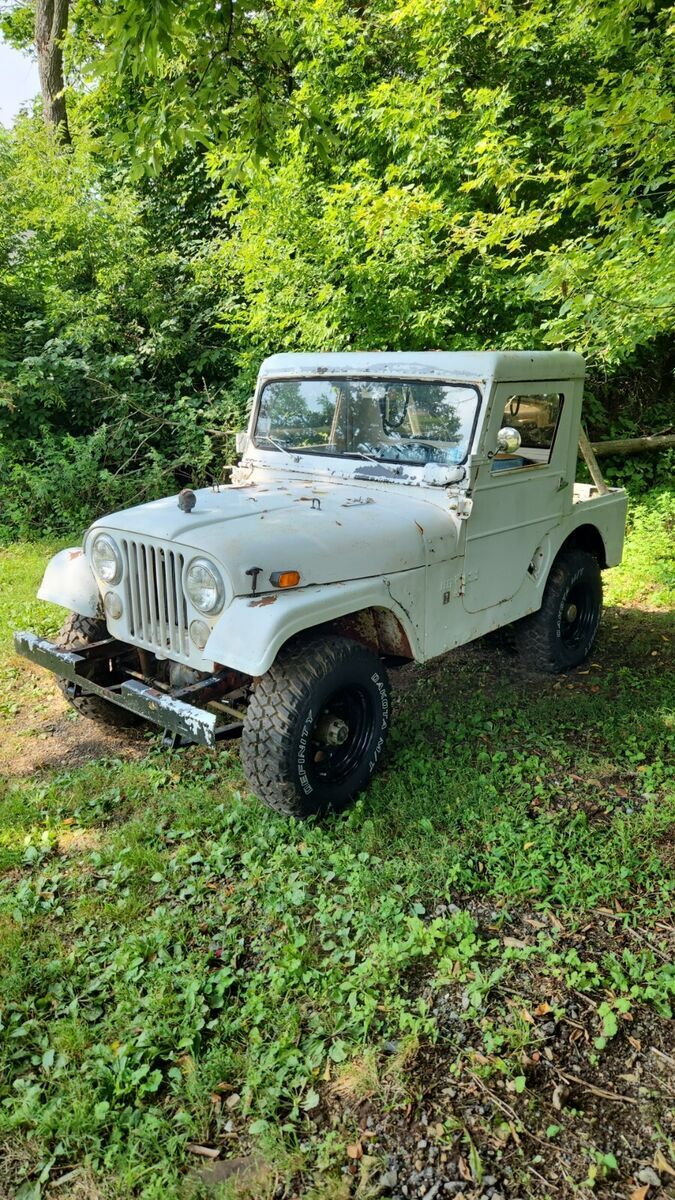 super rare jeep camper from the 1960s. warn overdrive. 4:88 gears. half cab