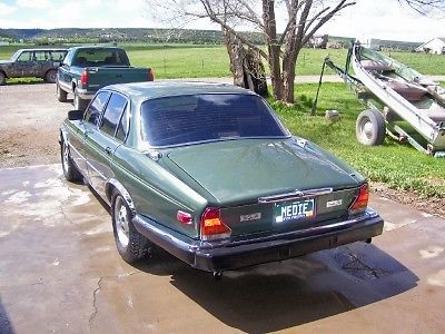 1986 vandenplas automatic with sheepskin seatcovers. green, walnut dashboard