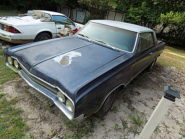 1965 442 restoration project 455 auto floor shift headers/all the trim is in car
