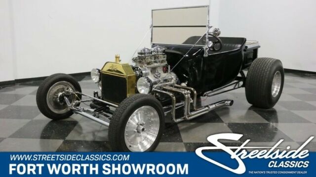 strong chevy v8, auto, dual 4 bbls, 4 wheel power disc brakes, fun t-bucket!
