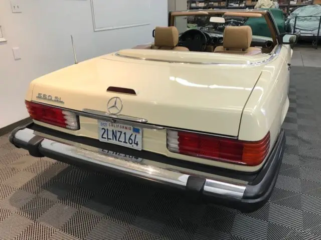 1988 mercedes benz 560 sl. light ivory with palomino trim. dark brown soft top