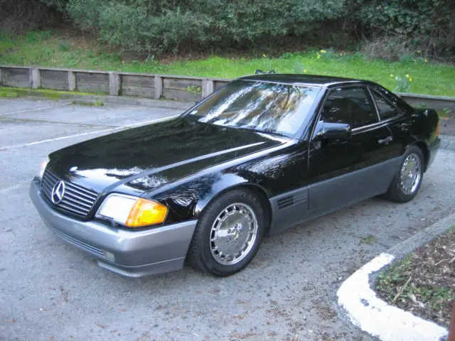 1992 mbz 500 sl roadster. 5.0 v8 32v. 322 horsepower 4 speed auto. black/ tan