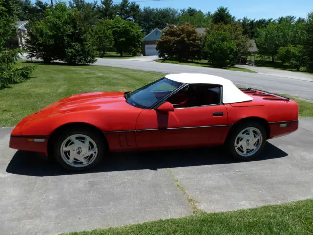 red 1988 convertible with white top; 58k miles