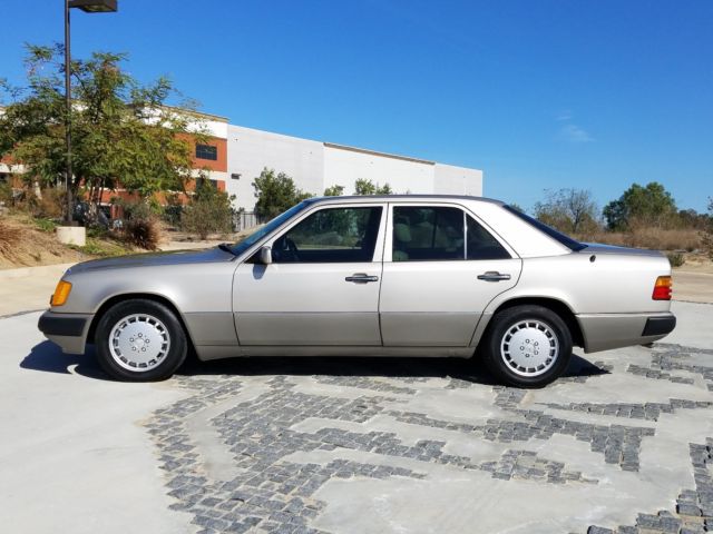 mercedes-benz 300e finished in gorgeous smoke silver on tan