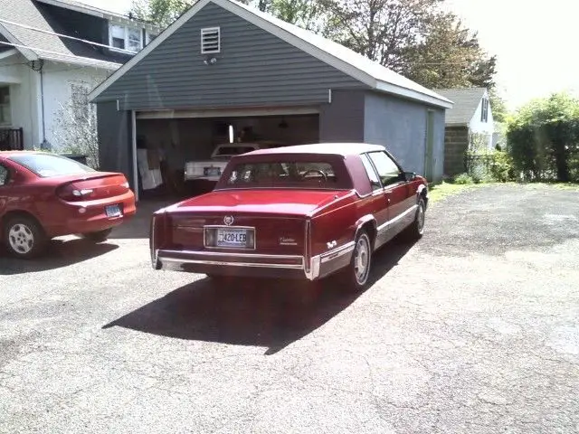 1991 cadillac coupe deville spring edition..red/red