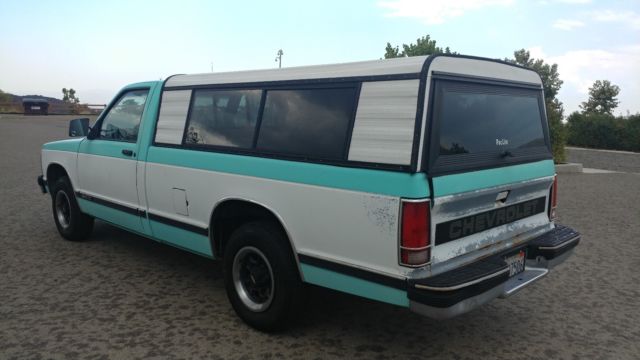 clean rustfree california regular cab long bed! v6 5 spd manual tahoe pkg!