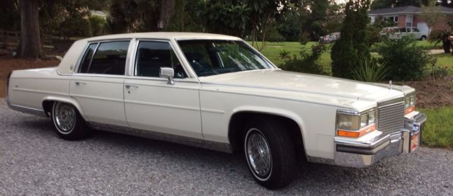 1988 white cadillac fleetwood brougham - new paint, new vinyl, very good cond.!