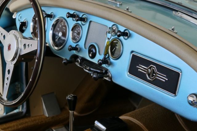 1957 mg mga convertible ...metallic blue with tan interior