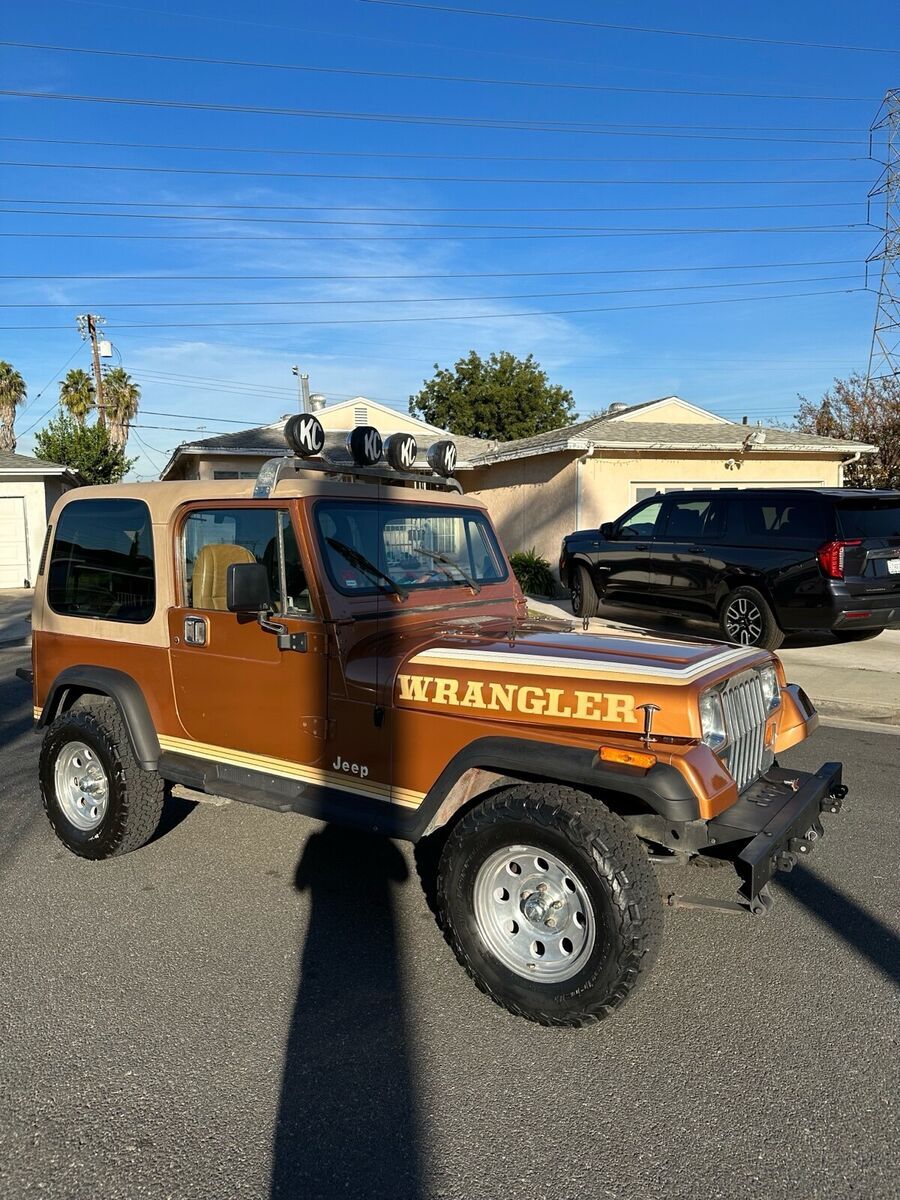 1987 jeep wrangler orange 4wd manual sport