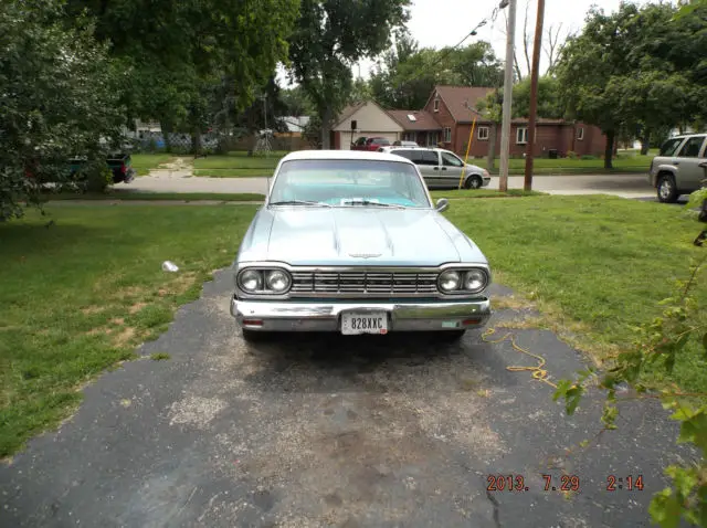 a 1964 rambler ambassador 990 blue with white top