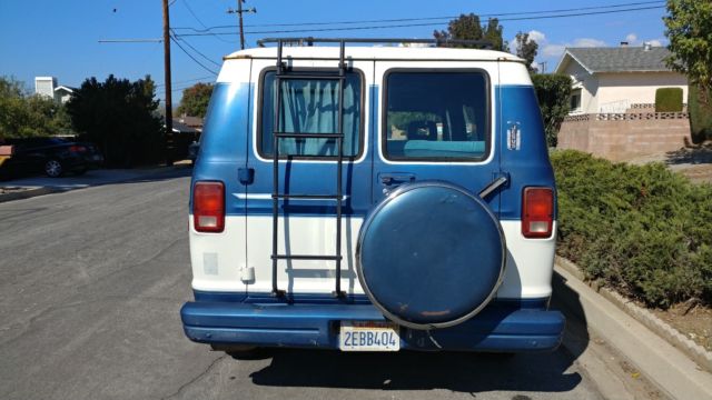 cool looking california custom b150! clean solid camper van!