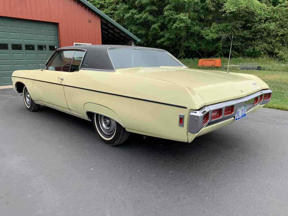 1969 chevrolet impala yellow rwd automatic custom coupe