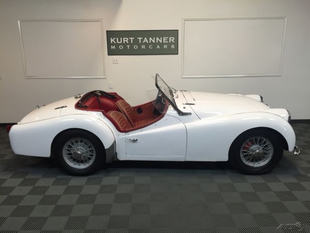 1960 triumph tr3a sports roadster. white with red trim, 4 speed, wire wheels