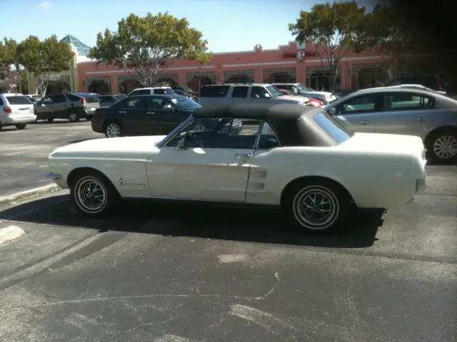 clean classic white convertible with black interior