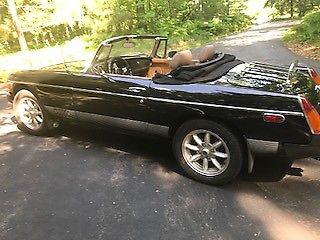 excellent condition gloss black 1980 mg b convertible with several upgrades