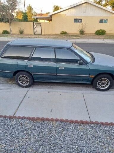 1992 subaru legacy wagon. body in good condition. 1 dent. faded paint