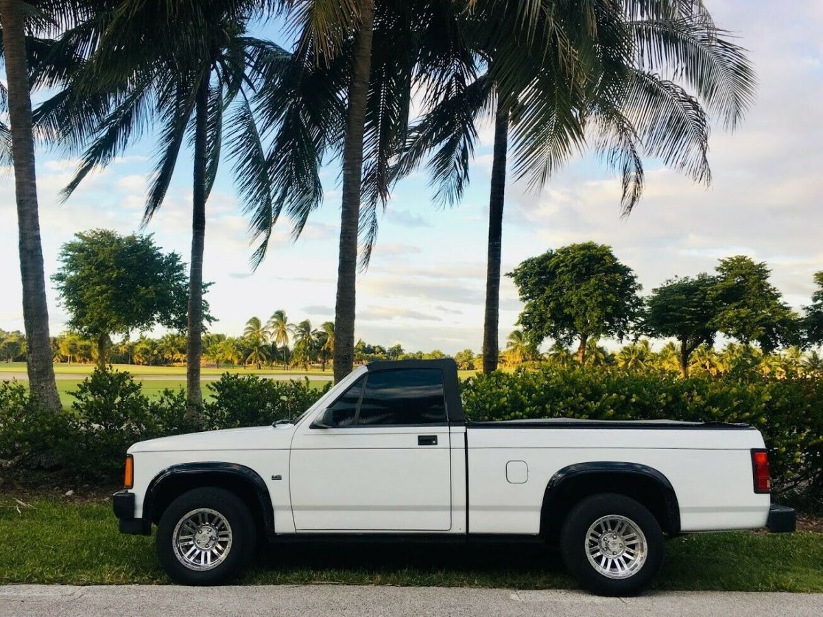 only 2,000 produced, 200 remaining. tinted windows, power steering. white on red